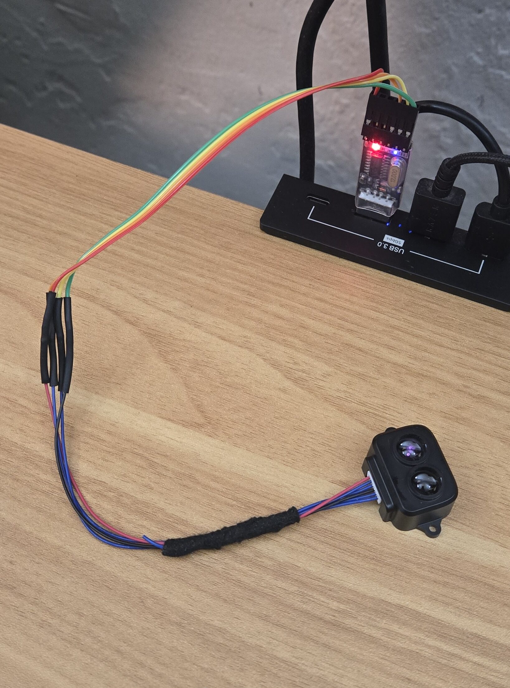 Benewake TF-Luna LiDAR connected to a USB serial adapter for ROS 2 development.